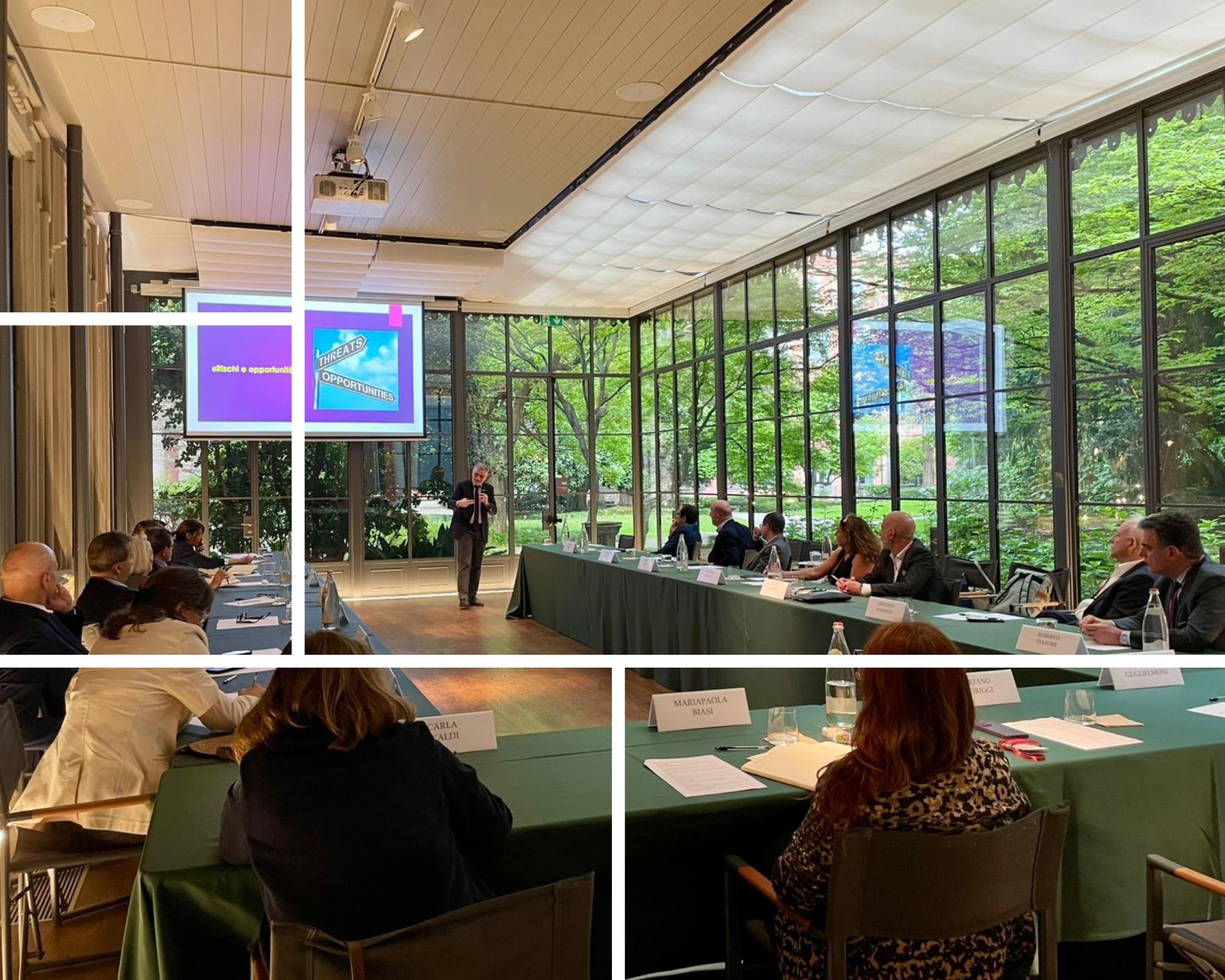 Fragmented view of an executive roundtable in a glass-walled conference room, where a speaker presents slides on risks and opportunities to a group of managers seated around a long table at Museo Poldi Pezzoli
